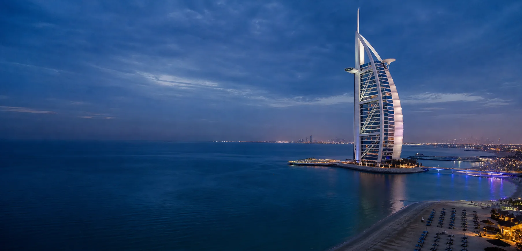 Blue-hour view of the Burj Al Arab and Dubai coastline